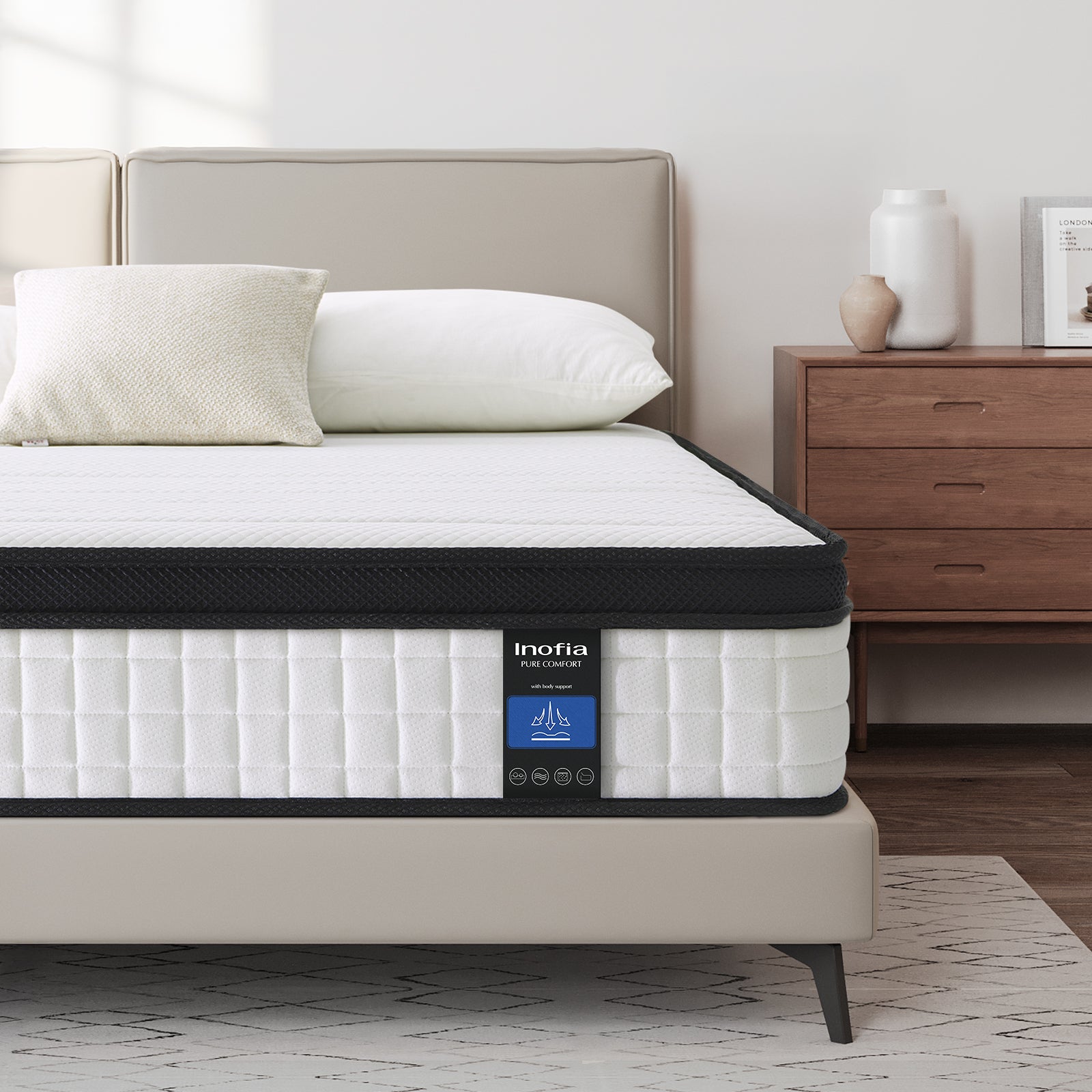 Double mattress with Inofia branding on a bed in a bedroom setting