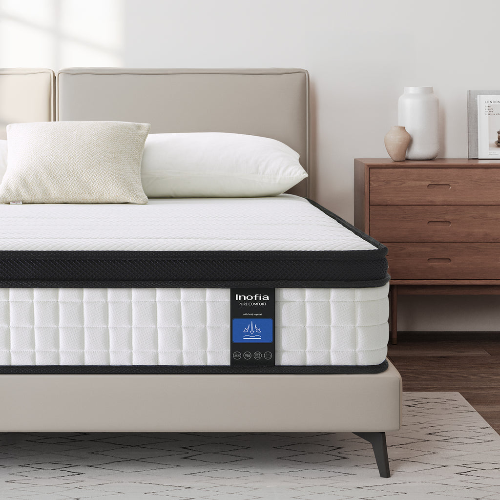 Double mattress with Inofia branding on a bed in a bedroom setting