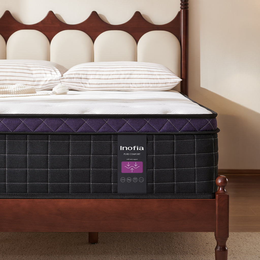 single foam mattress with Inofia branding on a wooden bed frame with pillows.